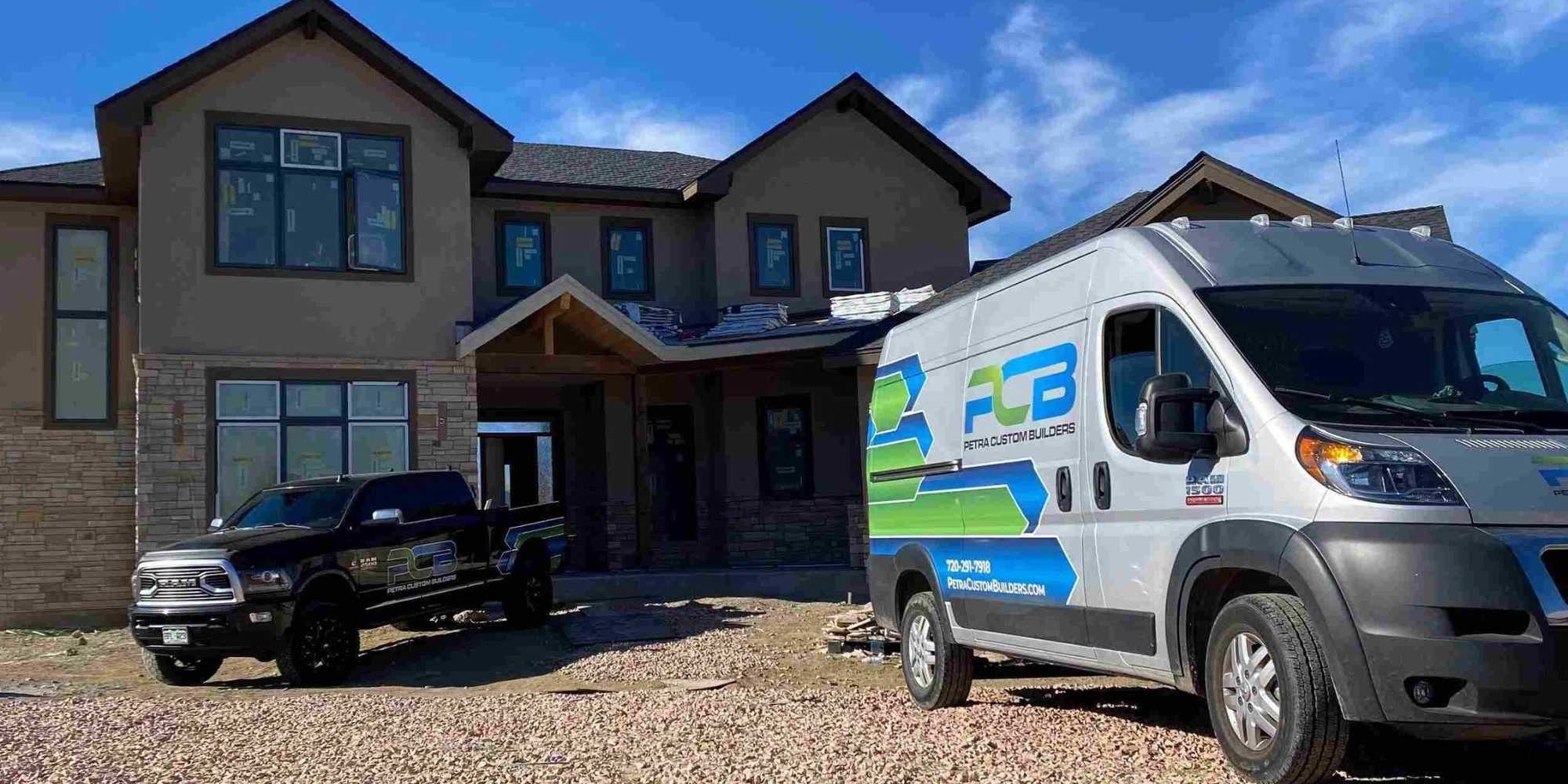 Image of Petras vehicles in front of a custom home in Boulder, CO