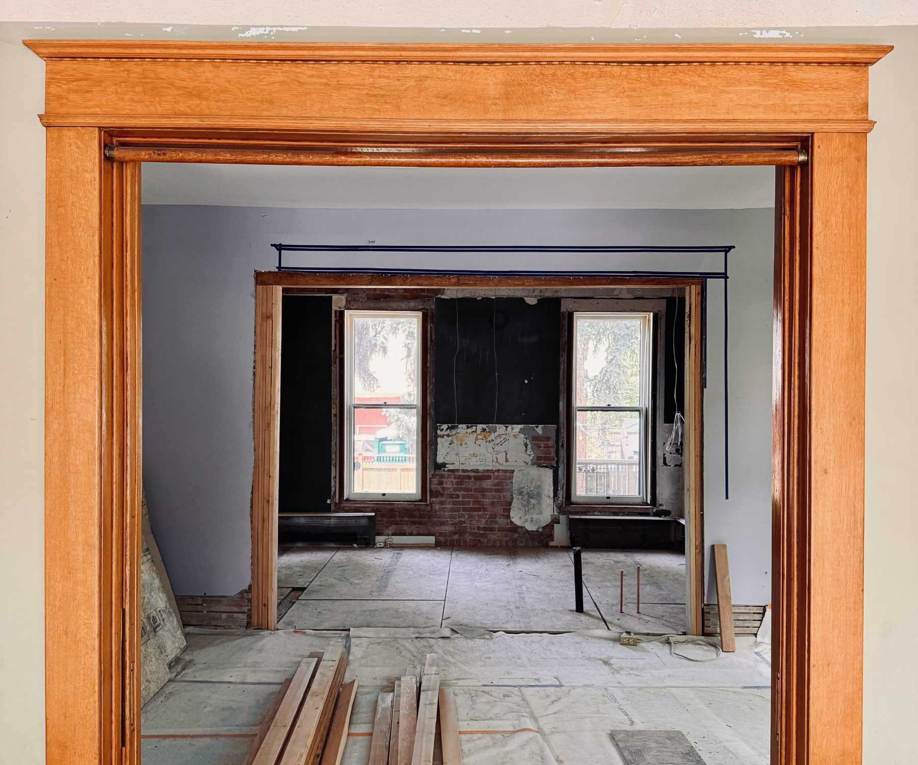 Photo of kitchen renovation in progress with exposed framing in Old Town Longmont, CO by Petra Custom Builders