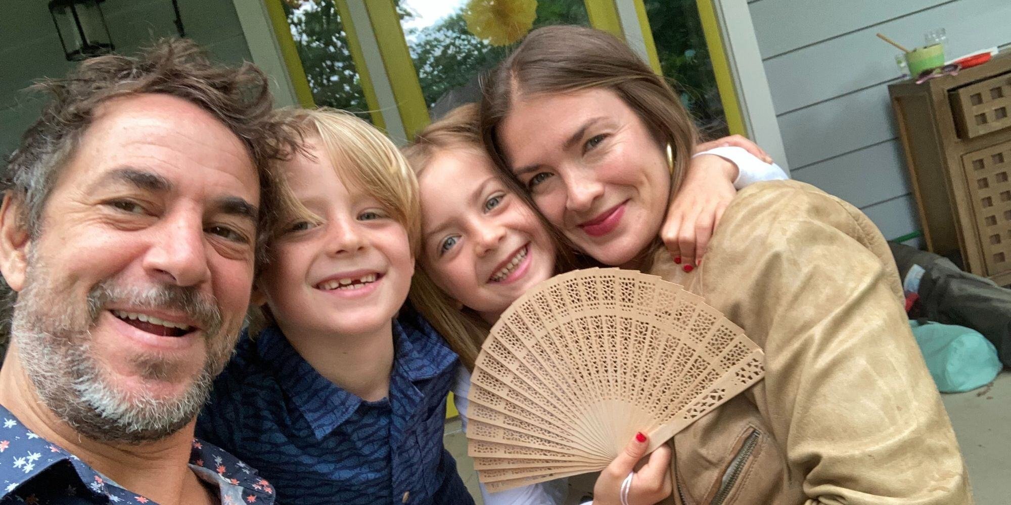 Family photo with a young boy and girl and a husband and wife