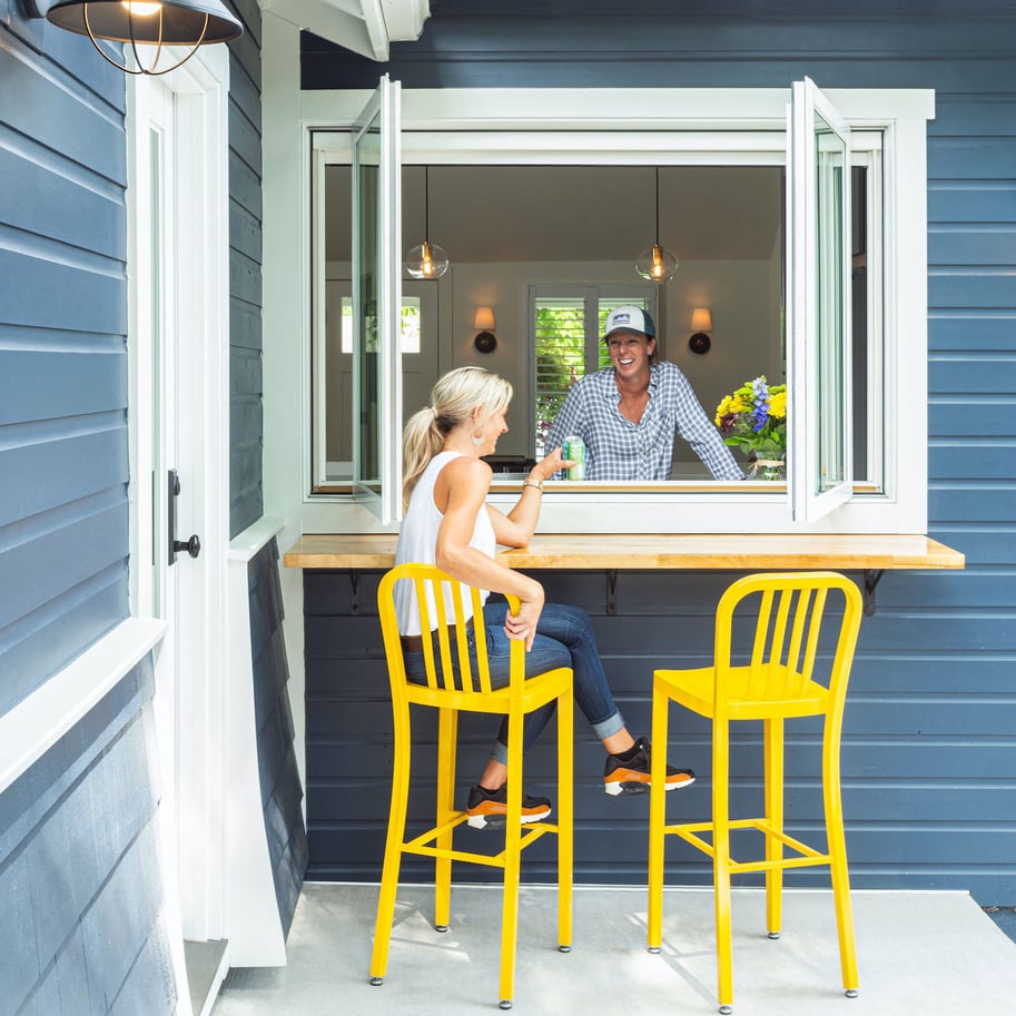 two women enjoying outdoor living entertainment space in boulder county