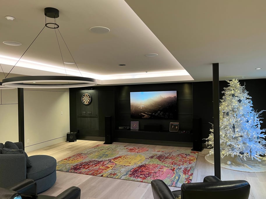 Basement remodel in boulder with black wall light wood floors