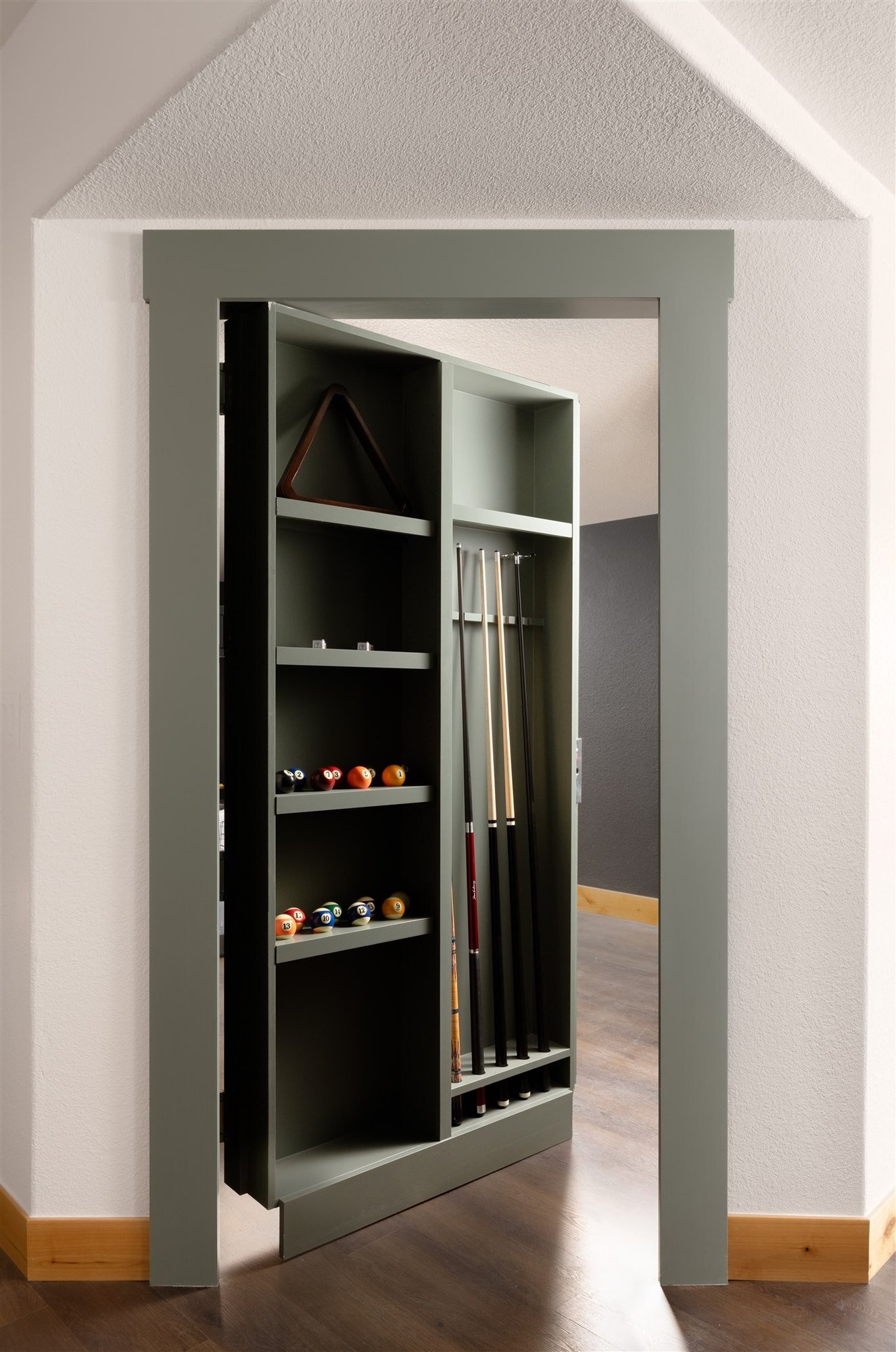 built-in hidden door with pool table storage