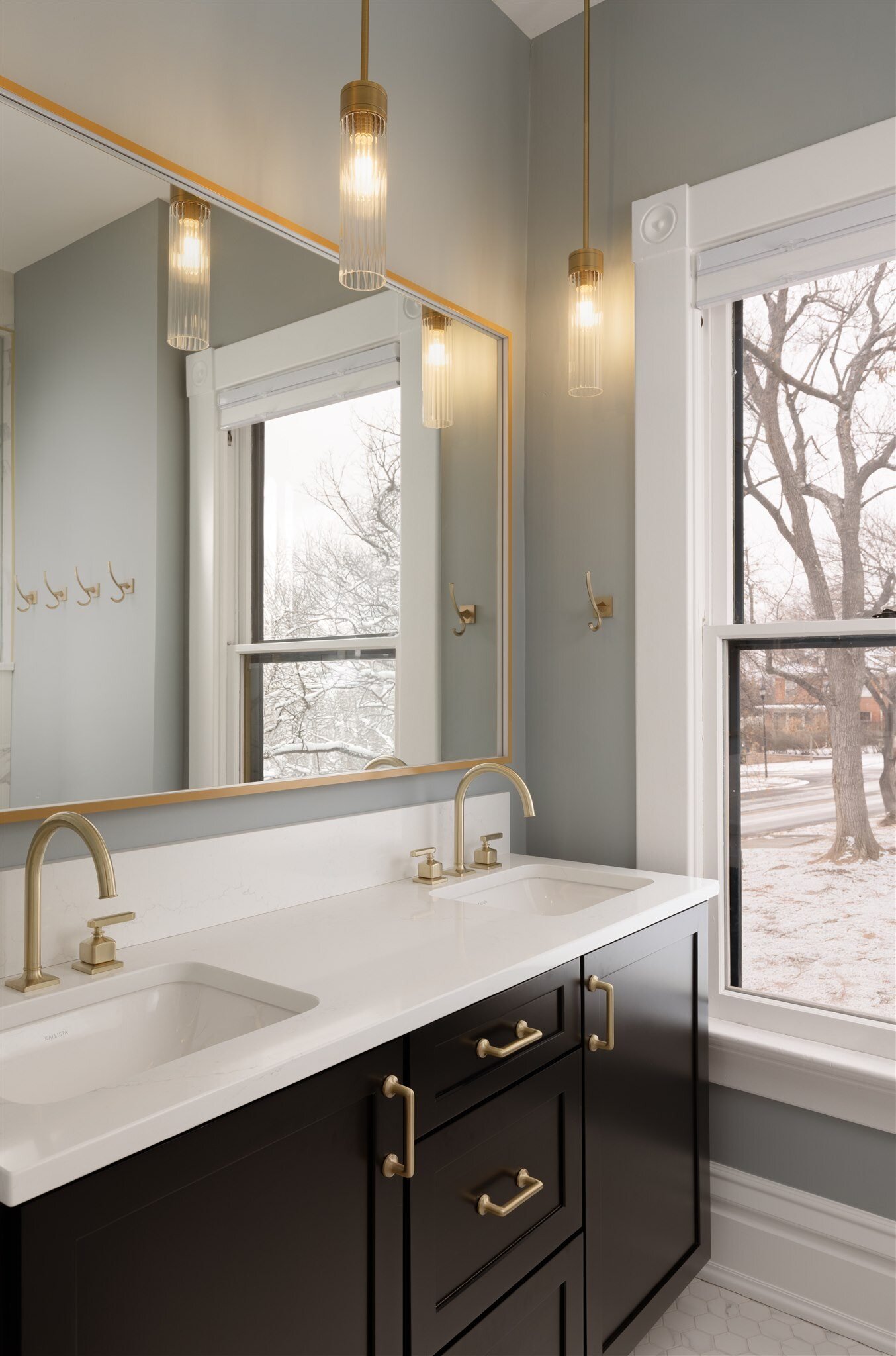 master bathroom vanity with gold fixtures in Longmont Colorado