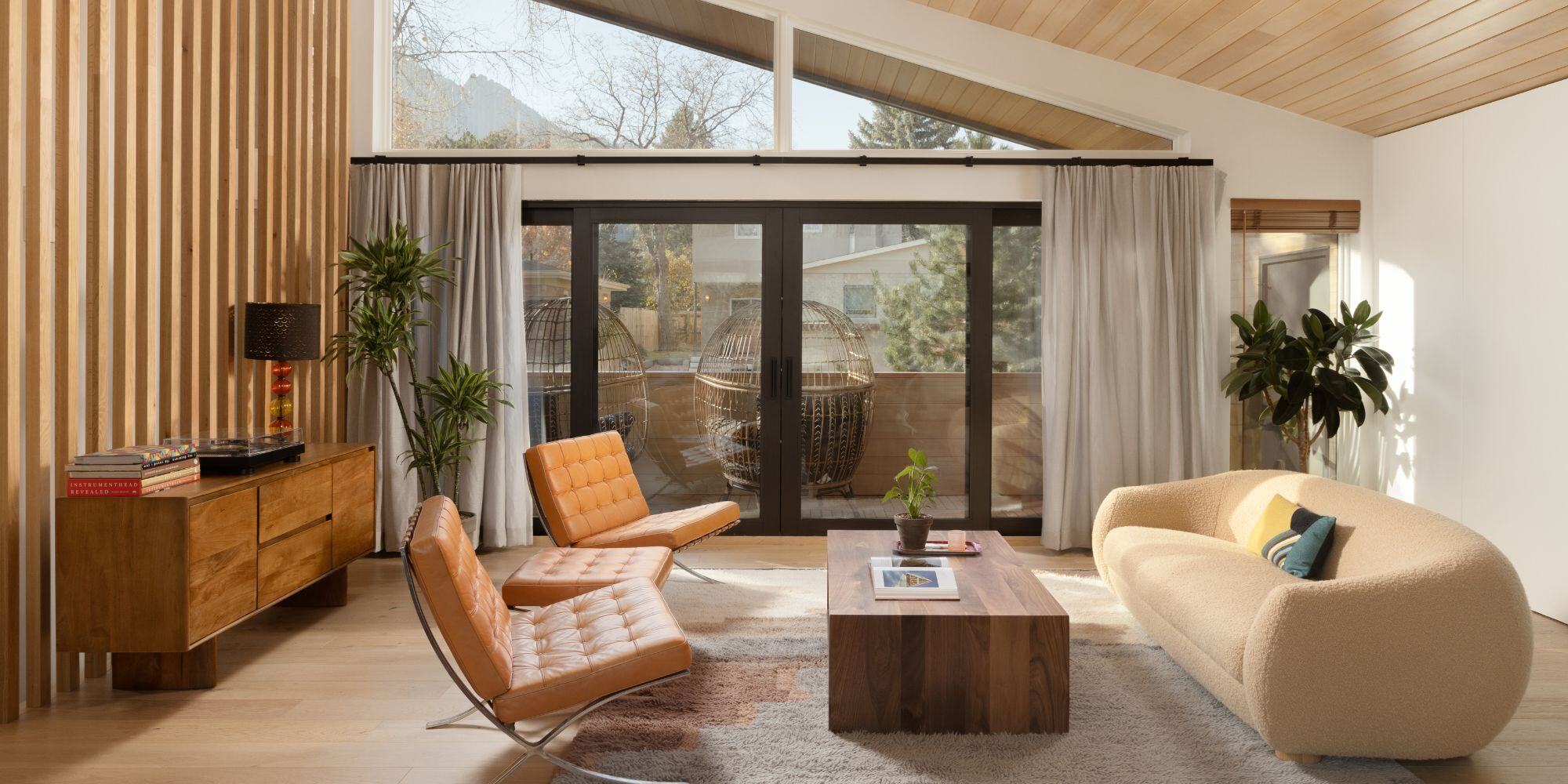 Home remodel in Boulder with mid century modern living room with tan and cream color pallette