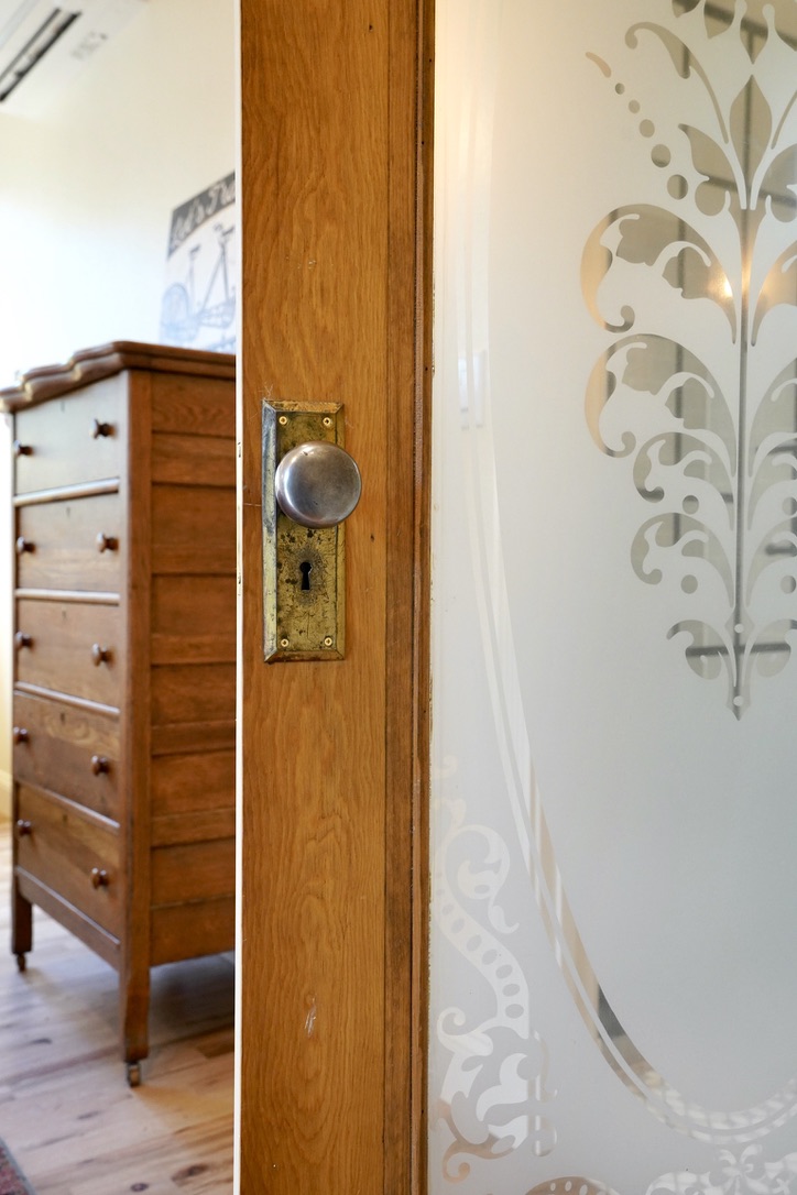 custom finishes including the glass on this bedroom door in Boulder ADU