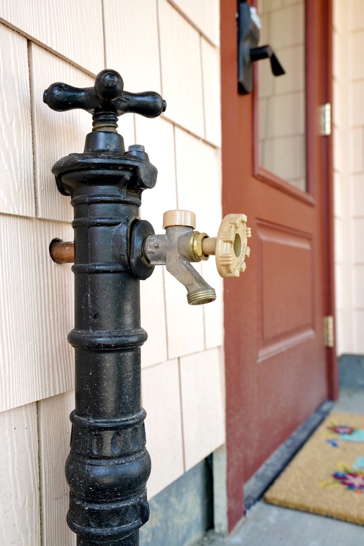 Antique spicket outside of The Tandem House