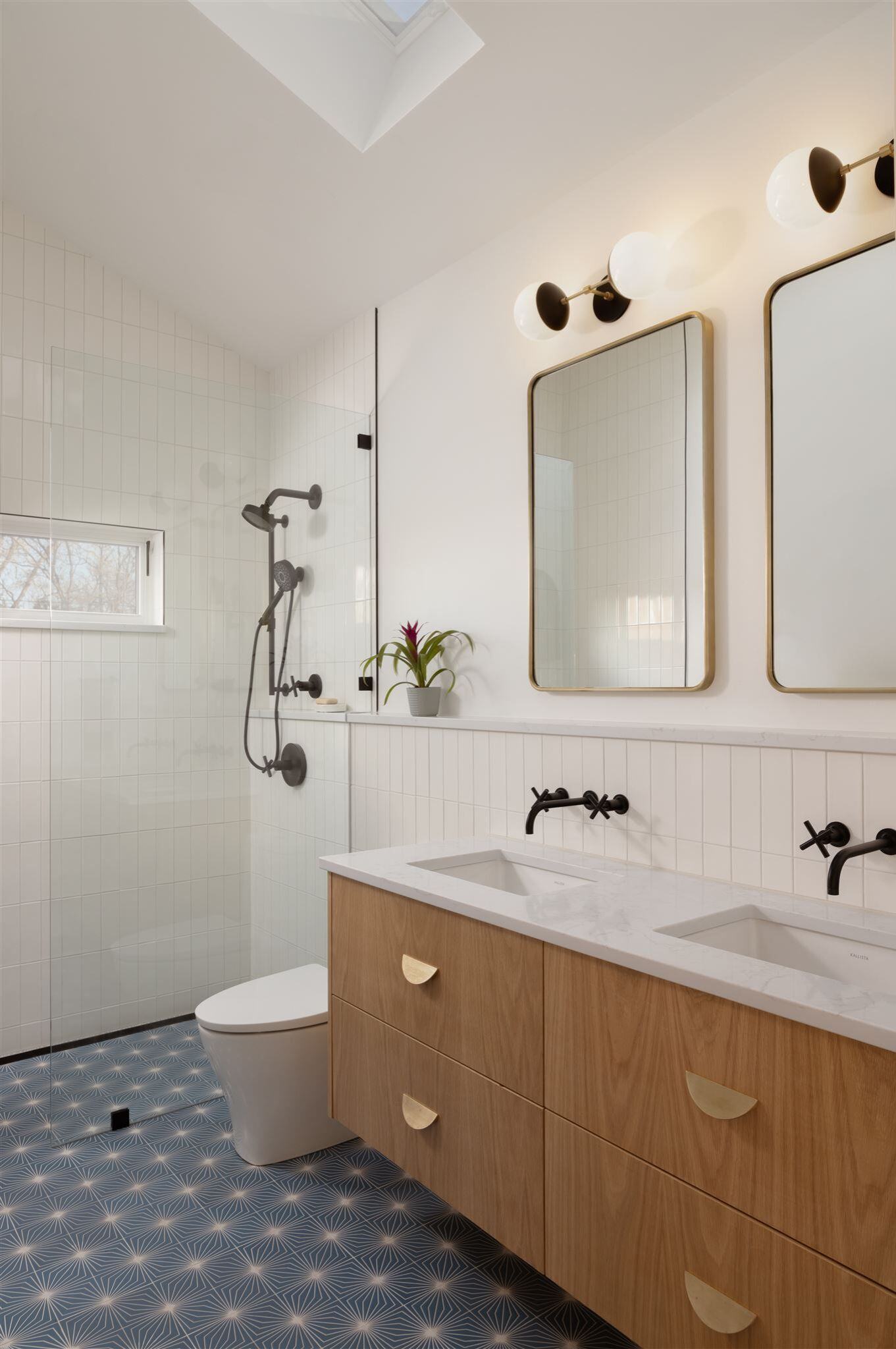 Remodeled bathroom in home addition with tile flooring and custom vanity