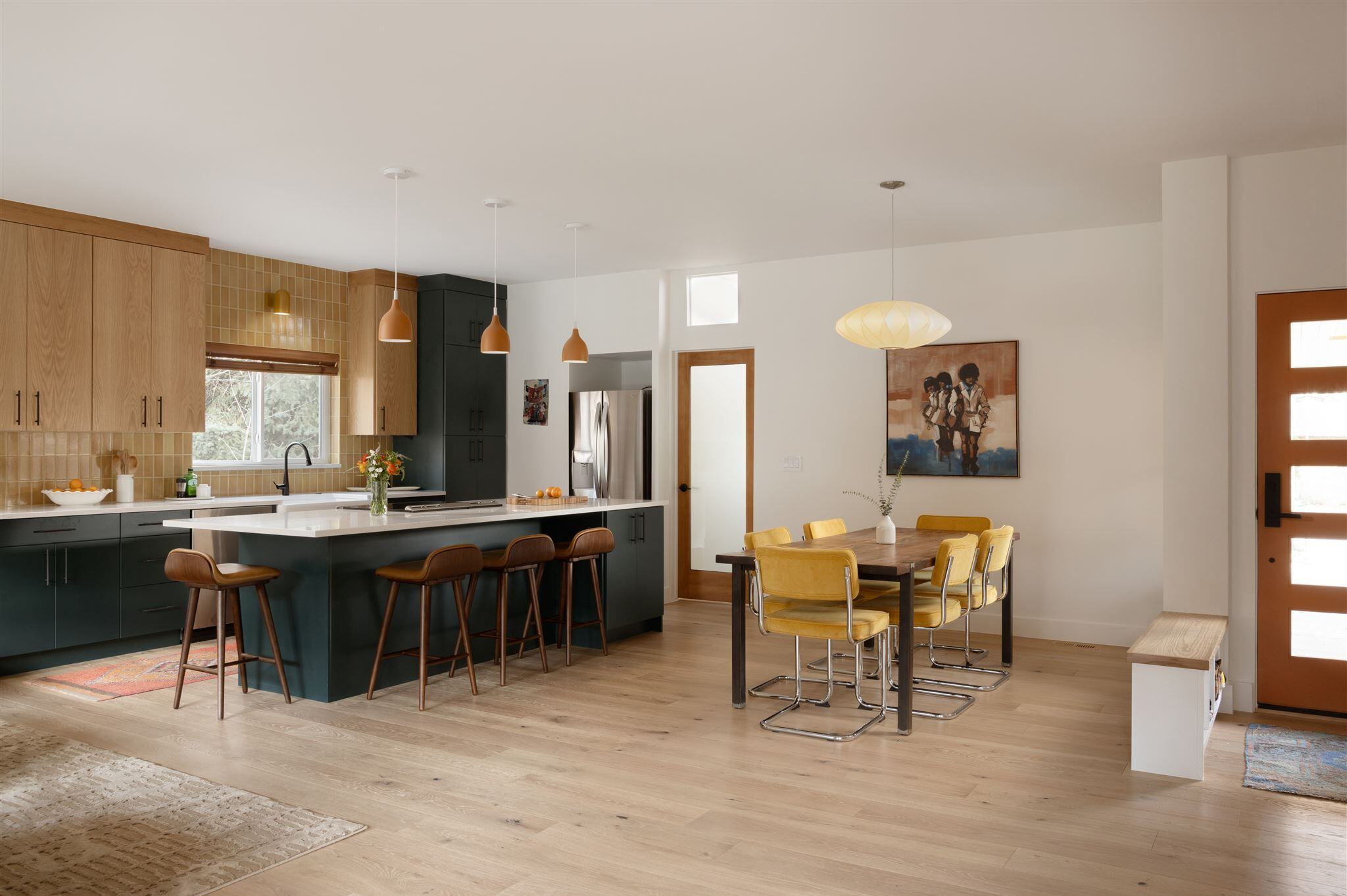 Remodeled kitchen and custom made bench at entry way with shelving in Boulder.